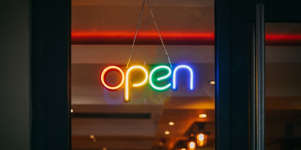Colourful neon 'Open' sign in a shop window