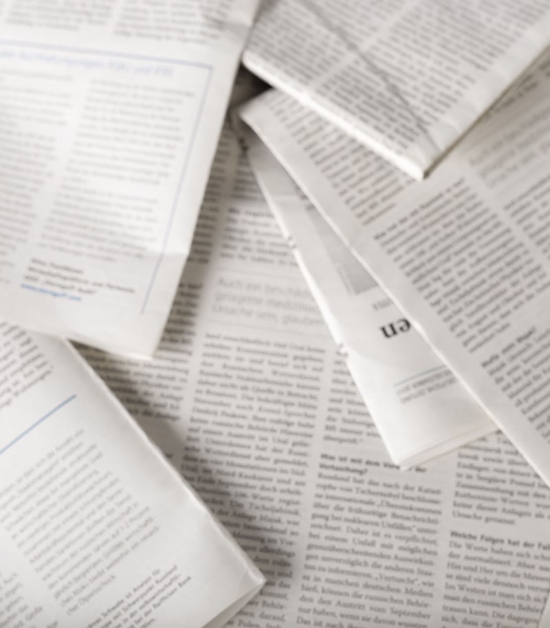 Overhead shot of blurred pile of academic articles